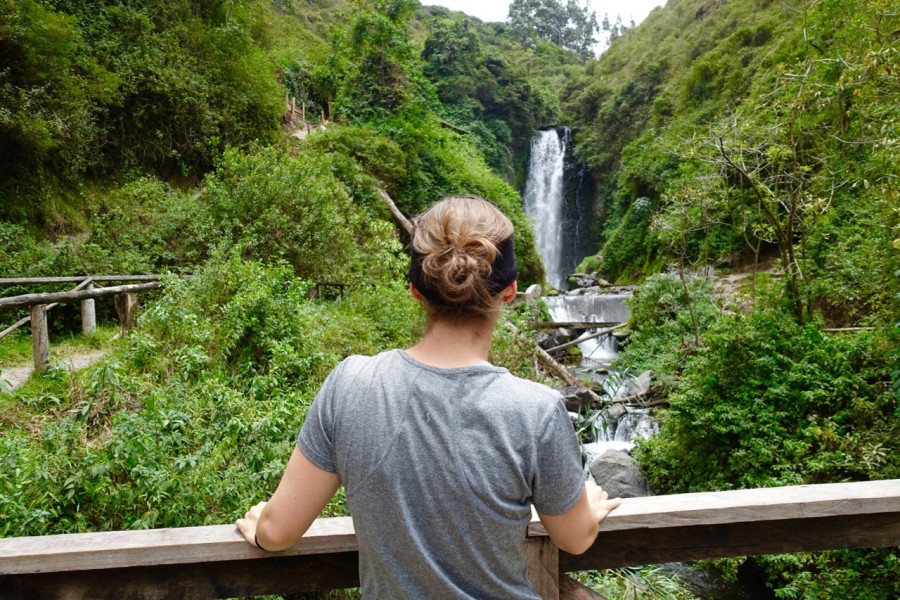 Michelle looking at waterfall in Otavalo Ecuador | Intentional Travelers