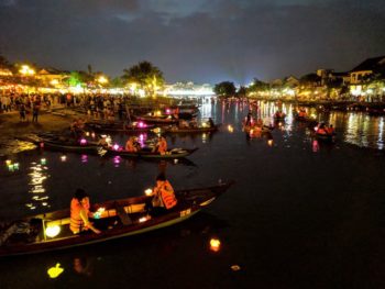 Lanterns and boats at the river during Lantern Festival in Hoi An, Vietnam