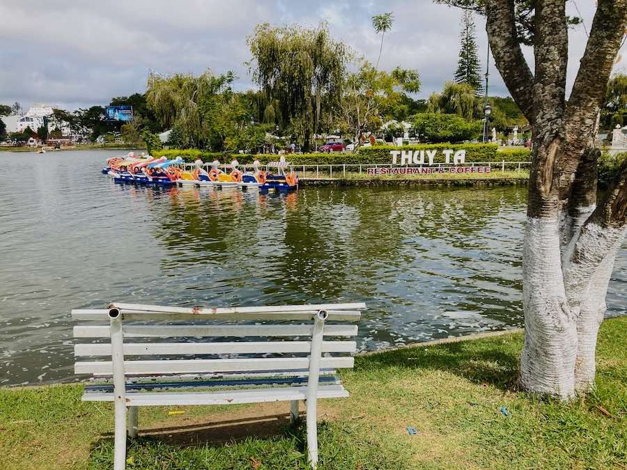 Dalat lake with bench and swan boats