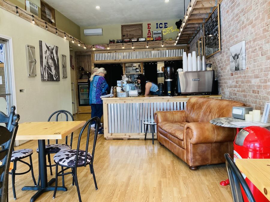 cafe interior, brick wall, coffee counter, chairs