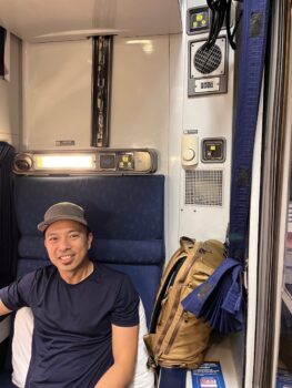 Jedd seated in roomette