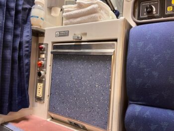 closed sink and nobs next to roomette seat