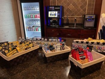 bottled drinks, coffee machine, and packaged snacks