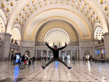 Jedd Jumping under archway of DC train station