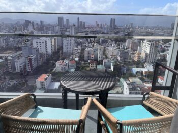 two chairs on balcony over city view in Da Nang Vietnam