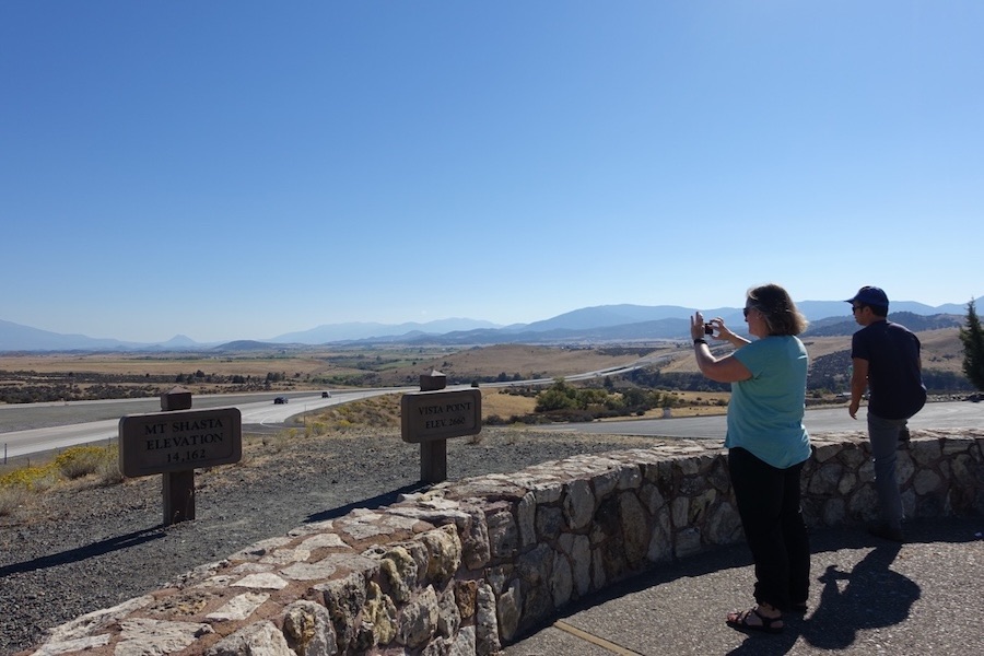 two people taking pictures at Shasta viewpoint