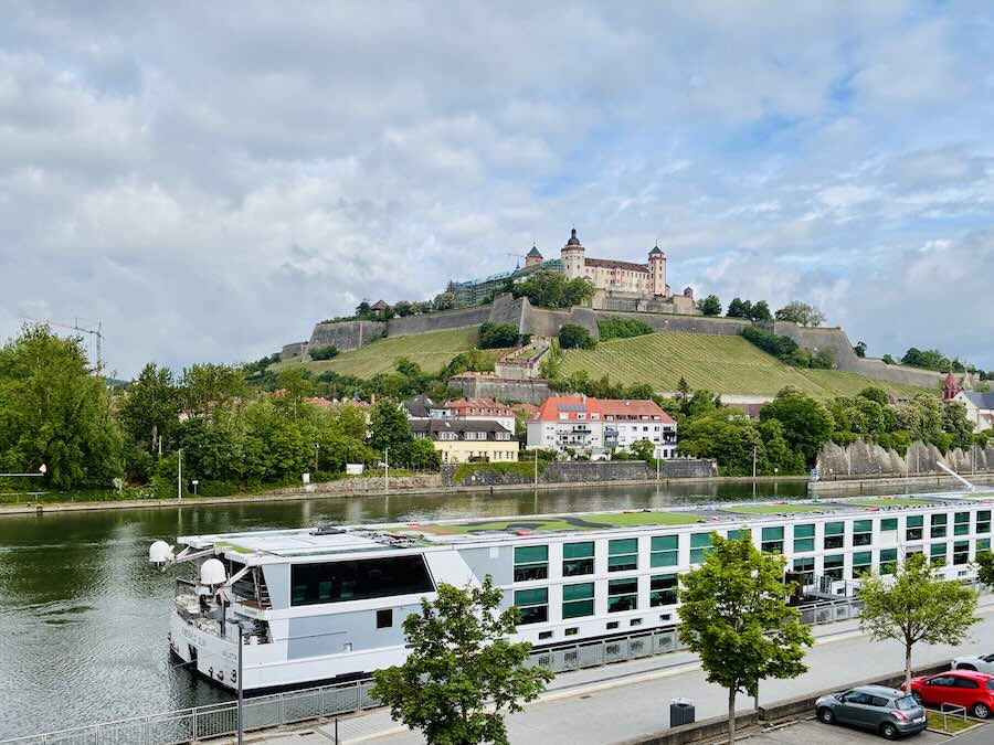 Scenic Emerald ship docked on Main in Wurzburg with castle in background